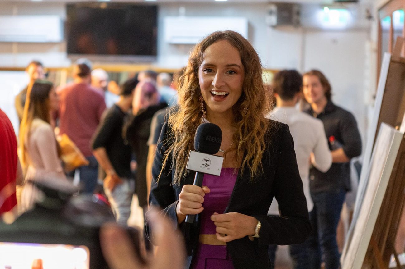 Georgina Humphries roving host at an event